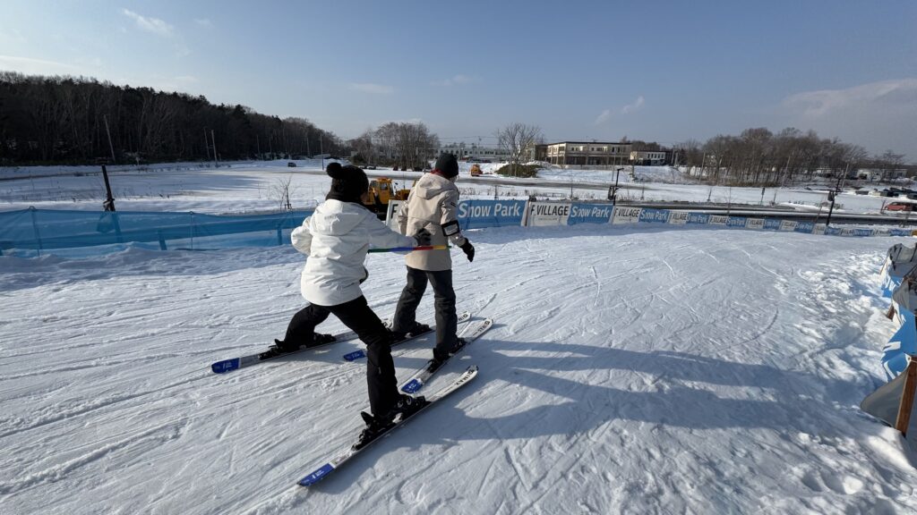 Learning to ski with a hula-hoop at F Village