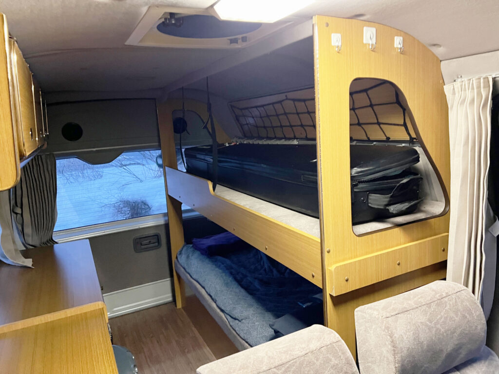 Keeping my snowboard and boots inside my snowboard bag in the top bunk kept things tidy and dry.