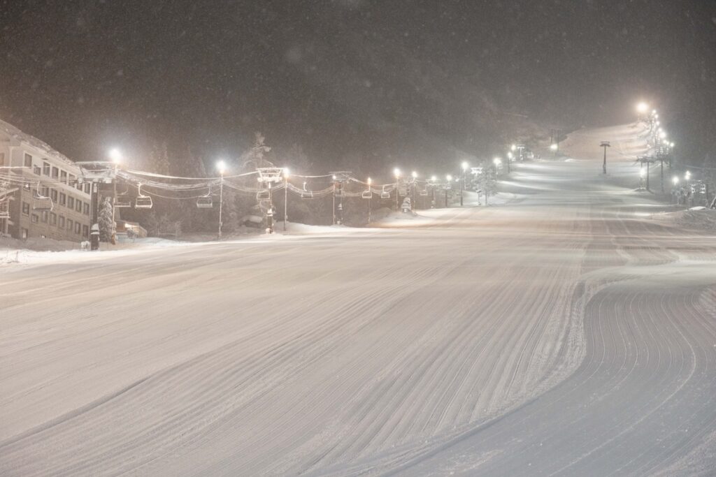 The lower slopes are freshly groomed for night skiing each day