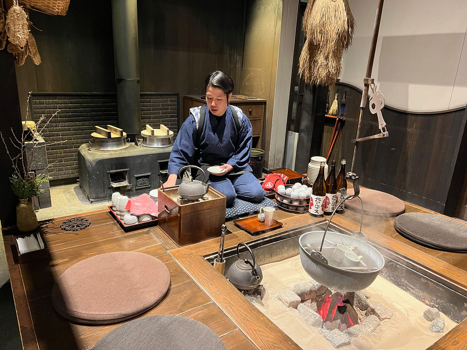 Each evening, guests can enjoy complimentary hot sake warmed by the fire.