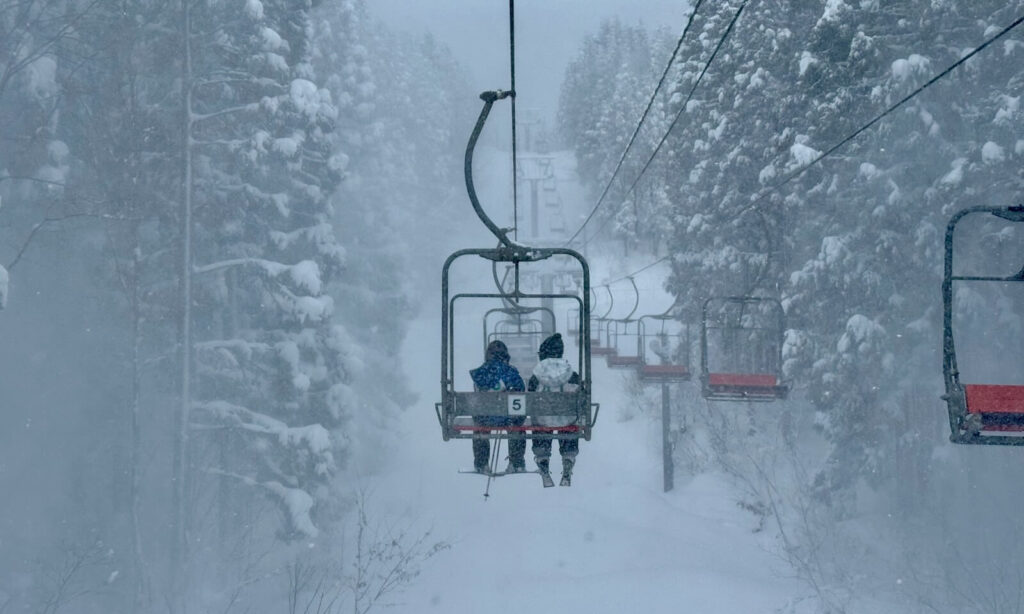 Children riding the Paradise Lift after ski school.