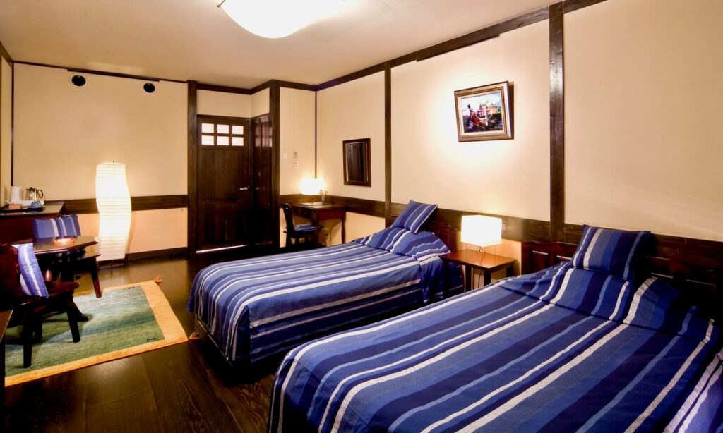 A guest room at Tamachi Bukeyashiki Hotel, blending traditional design with modern comfort. Image: Akita Prefectural Tourism Federation